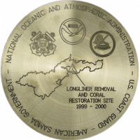 A commemorative medal that reads "National Oceanic and Atmospheric Administration. U.S. Coast Guard. American Samoa Government. Longliner Removal and Coral Restoration Site 1999-2000."