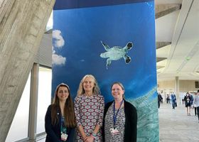 A photo of the NOAA delegation to INC-2 (L-R: Sammi Dowdell and Elizabeth McLanahan, NOAA/OIA; Nancy Wallace, NOS/ORR/MDP) (Credit: NOAA).