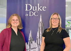 Amy V. Uhrin, Chief Scientist and Carlie Herring, Research Coordinator stand in front of a poster at Duke University's Workshop on the Social Cost of Plastic Pollution held in Washington DC.