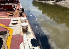 Oil alongside barge in Mississippi River observed on June 11, 2023