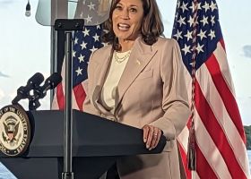 A woman at a podium.