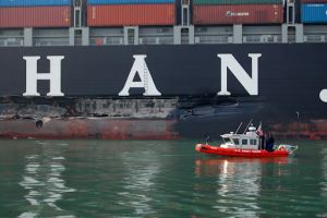 USCG patrol boat stationed next to the damaged port side of the M/V Cosco Busan. Image Credit: USCG