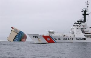 USCG Cutter Rush remains on station after the successful rescue of 23 crewmembers from the capsized vessel Cougar Ace. Image Credit: USCG