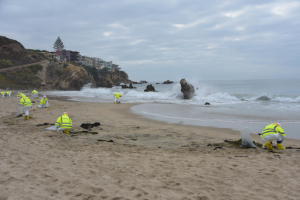 Members from the Orange County shoreline cleanup and assessment team conduct cleanup operations in the vicinity of Corona Del Mar State Beach Park, California. Image Credit: USCG/PO3, Janessa Warschkow