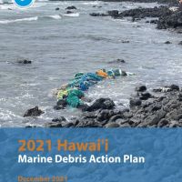 A photo of a beach with trash on a beach with "Hawai‘i Marine Debris Action Plan" on it.