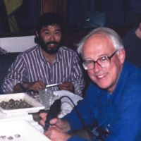 Two men sitting at a table.