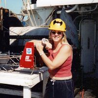 Woman posing on a research vessel.