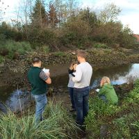 Group of students at a stream.