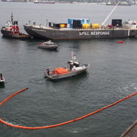  Response vessels demonstrating how to clean up spilled oil in water in Vancouver, B.C. 