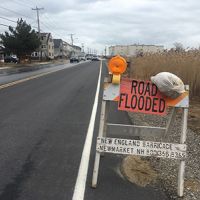 A warning sign on the side of the road due to high street flooding (Credit: New Hampshire Sea Grant).