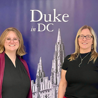 Amy V. Uhrin, Chief Scientist and Carlie Herring, Research Coordinator stand in front of a poster at Duke University's Workshop on the Social Cost of Plastic Pollution held in Washington DC.