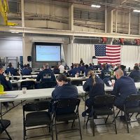 Participants of the Response Roadshow gathered around tables at the U.S. Coast Guard Atlantic Strike Team in Ft. Dix, New Jersey.