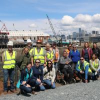 A team of NOAA staff outside a construction zone. 
