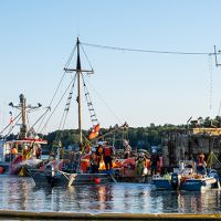 Response vessels assist a wrecked fishing vessel.