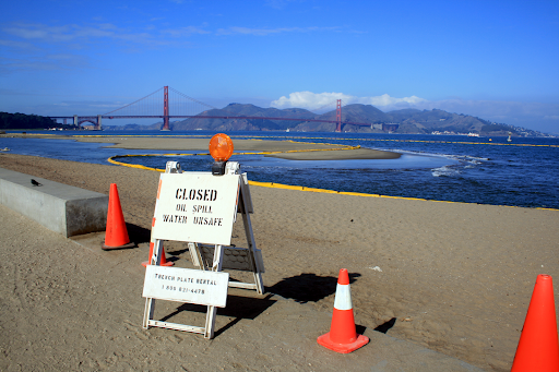 A sign indicating a closed beach.